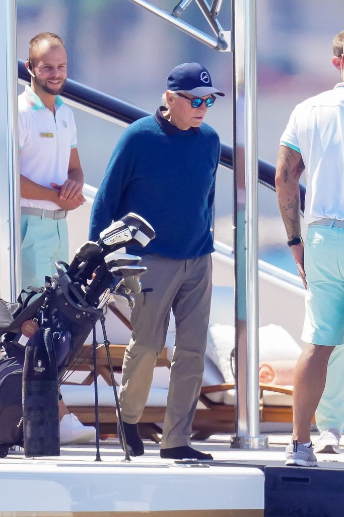 Michael Douglas took a helicopter from his yacht to play a round of golf before returning to enjoy the excitement of the Monaco Grand Prix