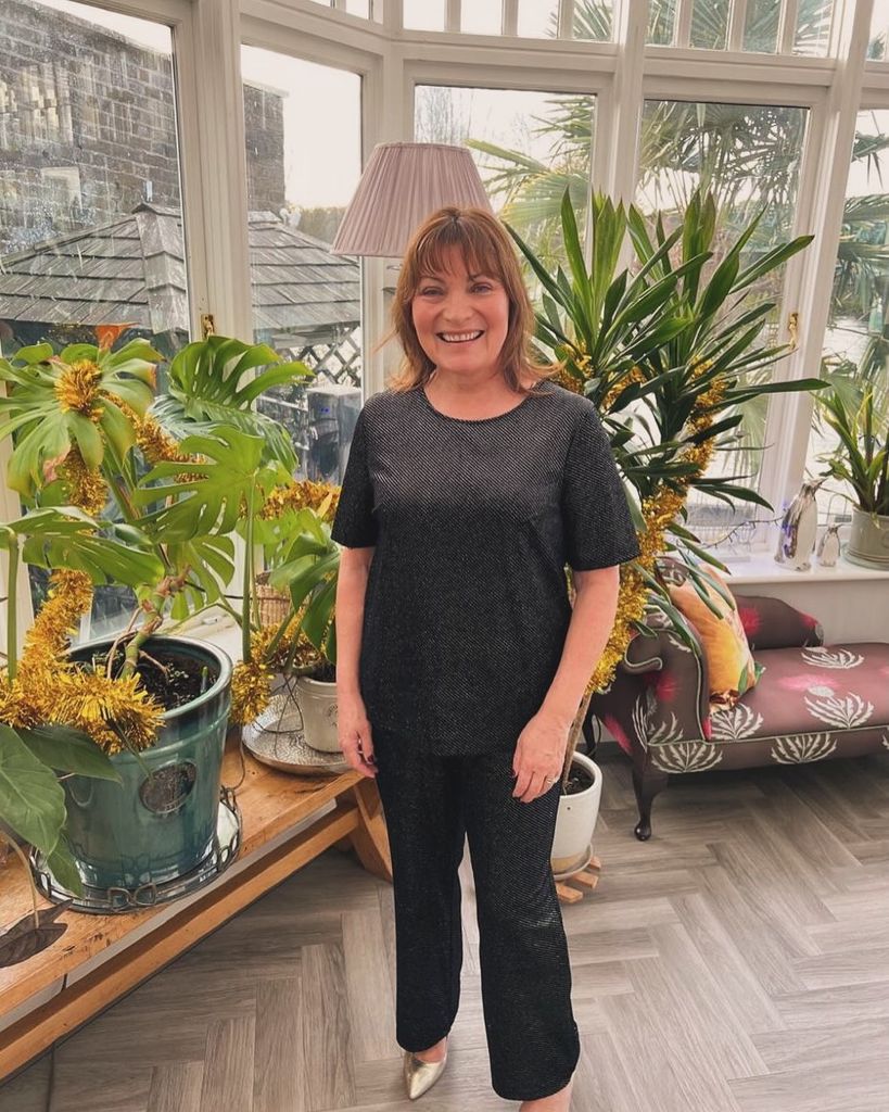 Lorraine Kelly in a black sparkly coord in her conservatory