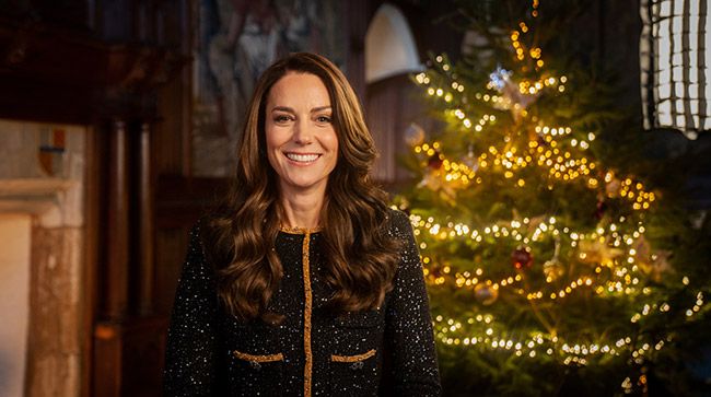Kate Middleton in gold in front of Christmas tree