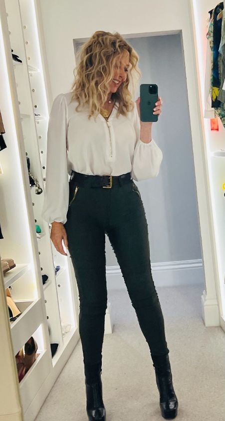 Carol Vorderman is an absolute dream in figure-hugging leather trousers ...