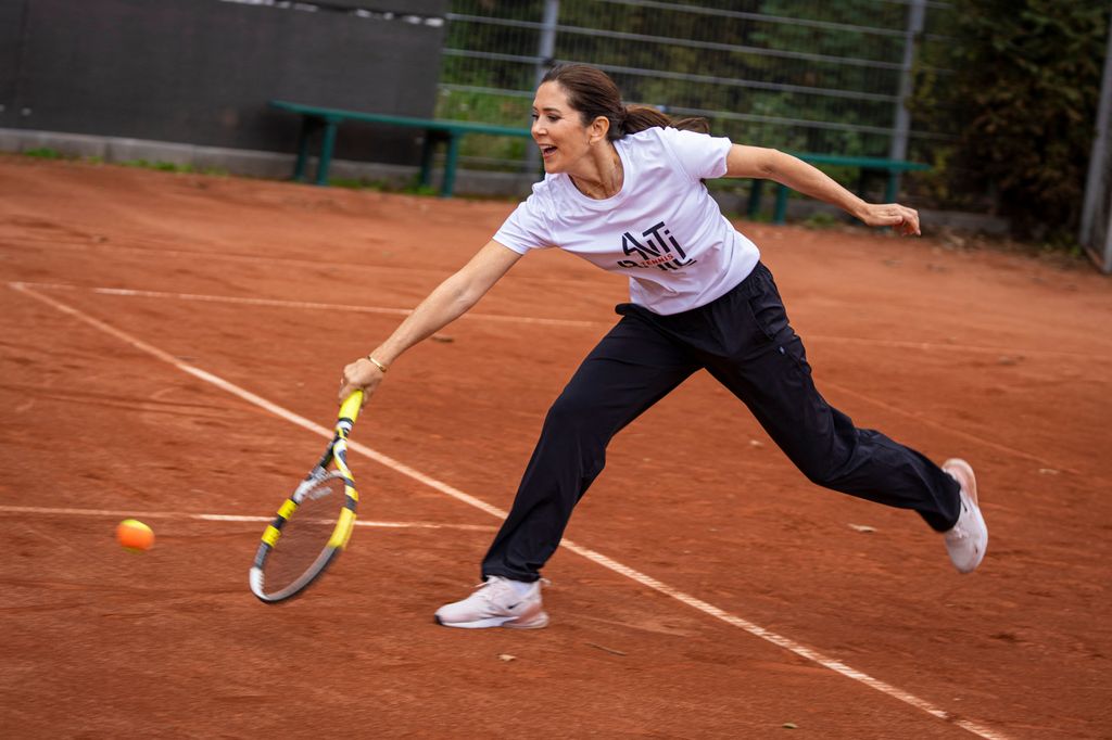 Denmark's Crown Princess Mary returns the ball at a visit in the Gladsaxe Tennis Club in Gladsaxe, north of Copenhagen