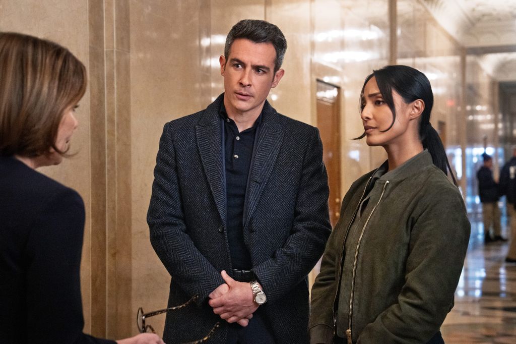 John Boyd as Special Agent Stuart Scola and Emily Alabi as Dani Rhodes on FBI