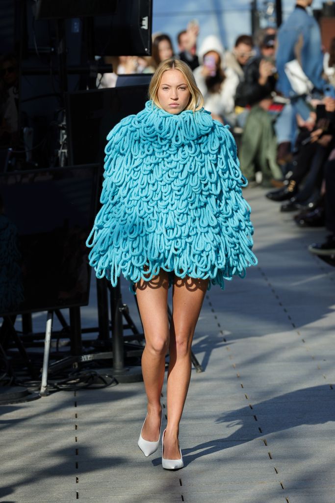 Kate Moss' daughter Lila walking the runway in shaggy blue dress