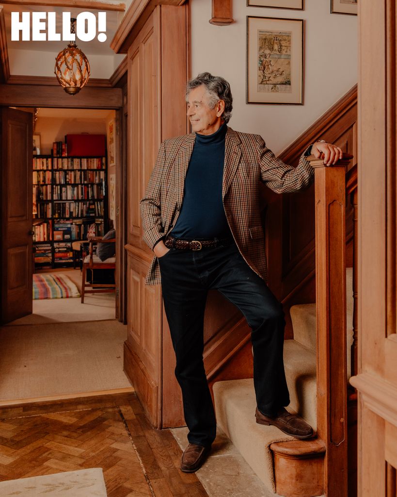 Emmanuel Olympitis posing by the wooden staircase 