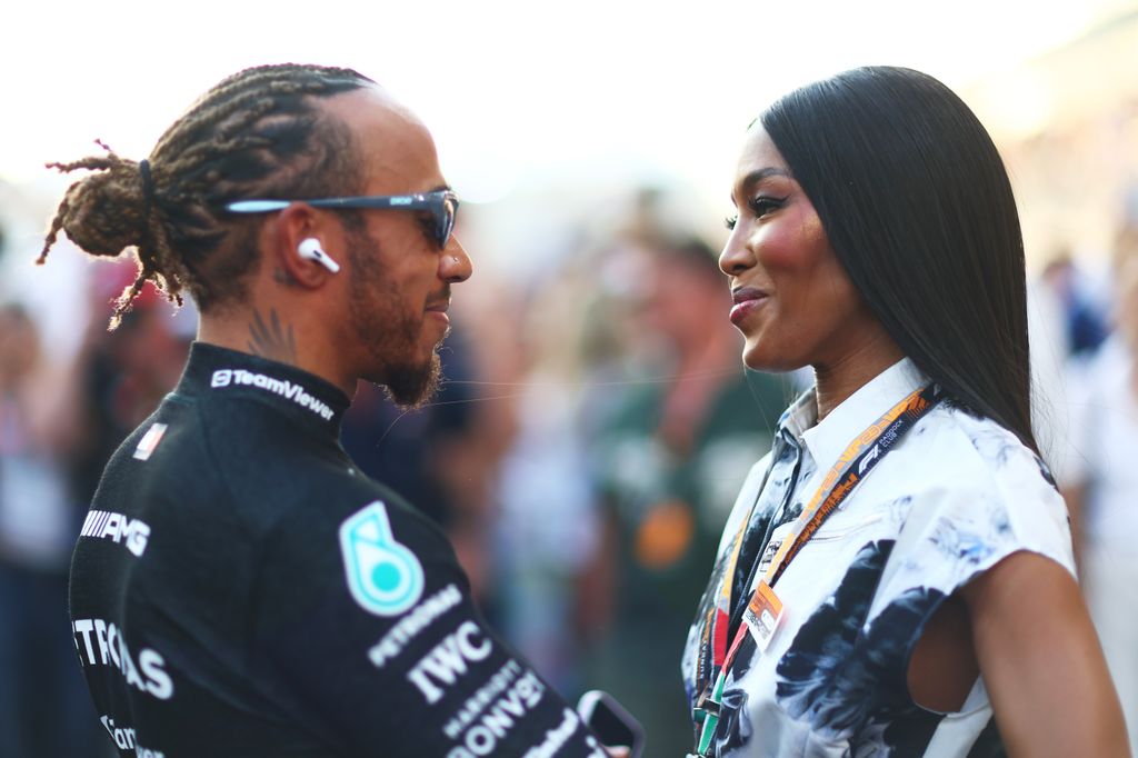 Lewis Hamilton of Great Britain and Mercedes talks to Naomi Campbell on the grid prior to the F1 Grand Prix of Abu Dhabi 