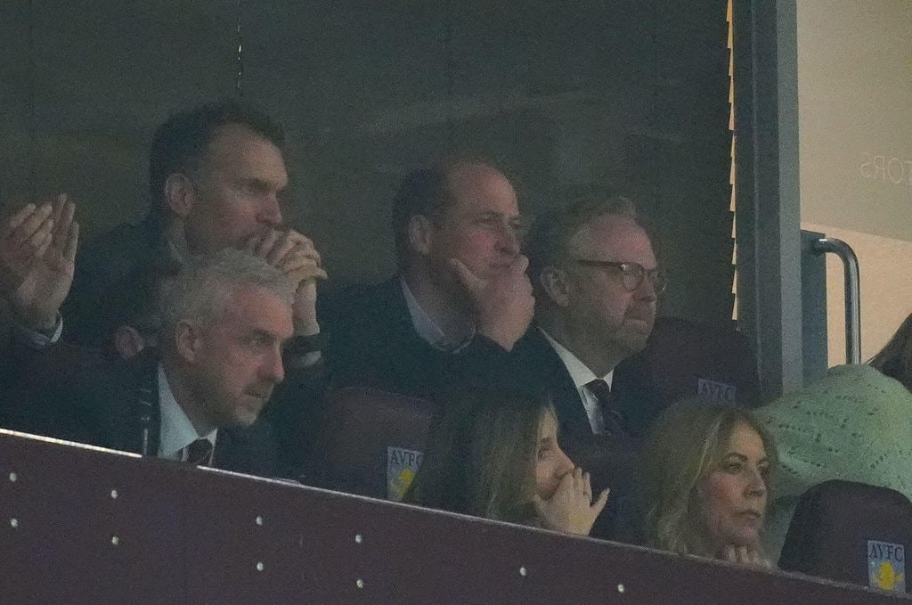 Prince William looking uncertain with other football fans