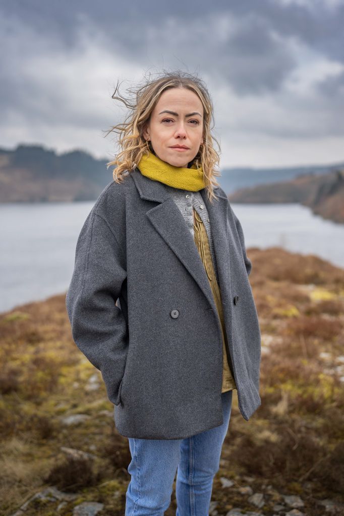 woman standing by lake