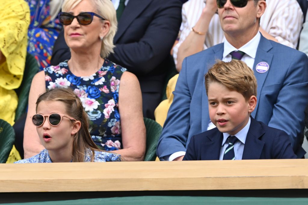 George and Charlotte leaning forward at Wimbledon
