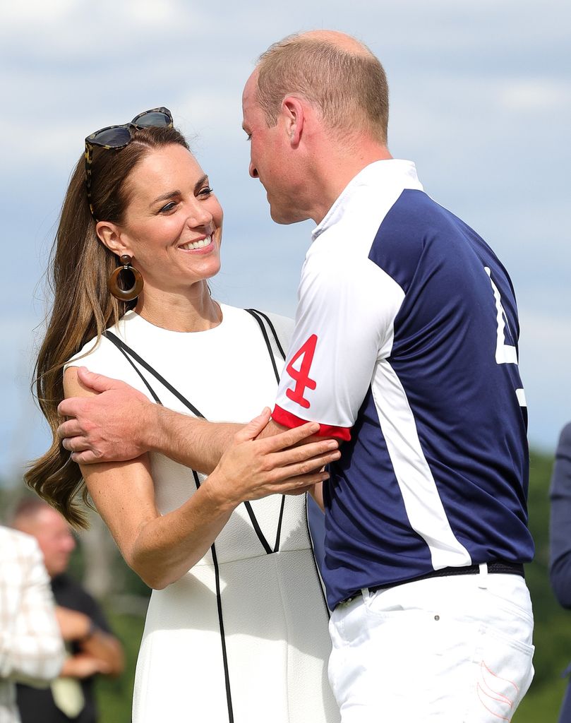WINDSOR, ENGLAND - JULY 06: Prince William, Duke of Cambridge and Catherine, Duchess of Cambridge embrace after the Royal Charity Polo Cup 2022 at Guards Polo Club during the Outsourcing Inc. Royal Polo Cup at Guards Polo Club, Flemish Farm on July 06, 2022 in Windsor, England. (Photo by Chris Jackson/Getty Images for TLA Worldwide)