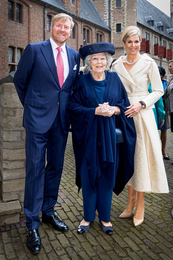Queen Maxima in ivory with willem-alexander and beatrix