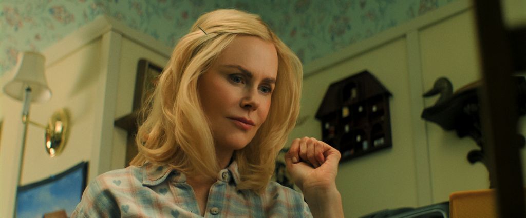 Close-up of blonde woman in kitchen