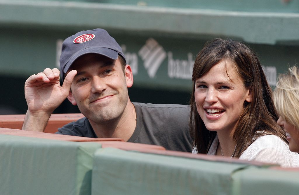 photo of ben affleck and jennifer garner sitting in dugout