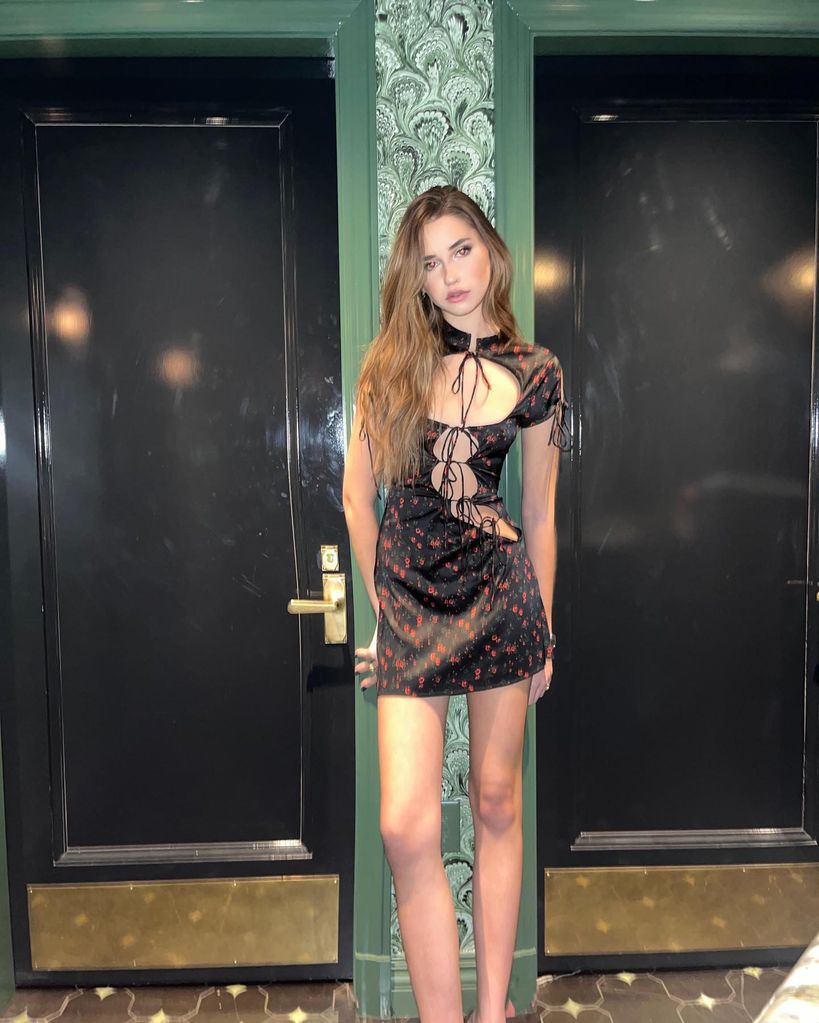 A photo of Savannah Hennessy wearing a black mini dress