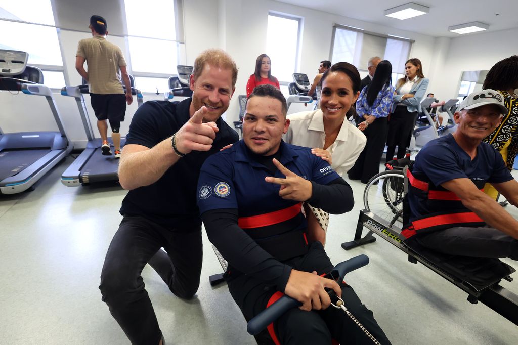 Prince Harry and Meghan with athletes on the rowing machine