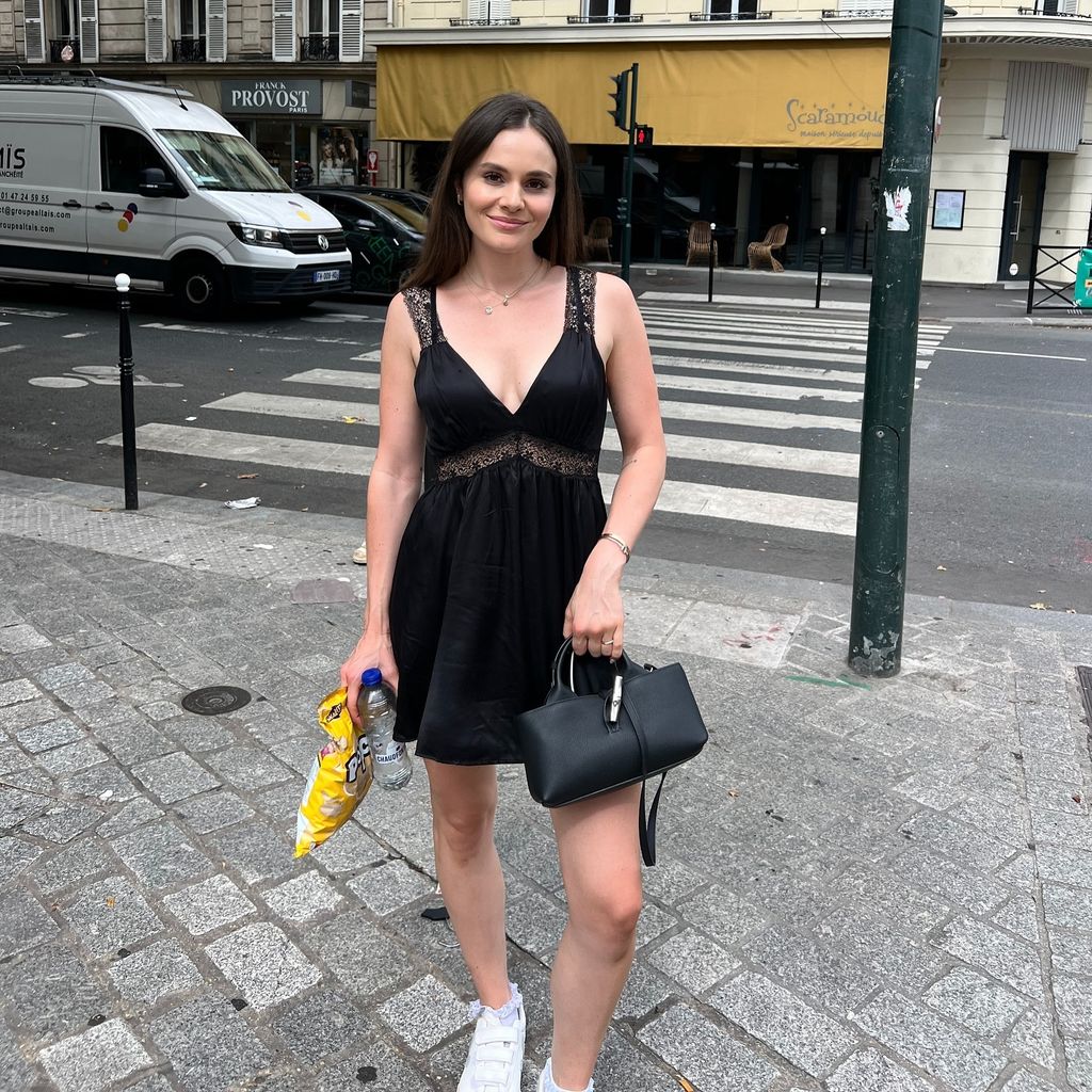 A photo of Holly Ramsay wearing a black lace dress 