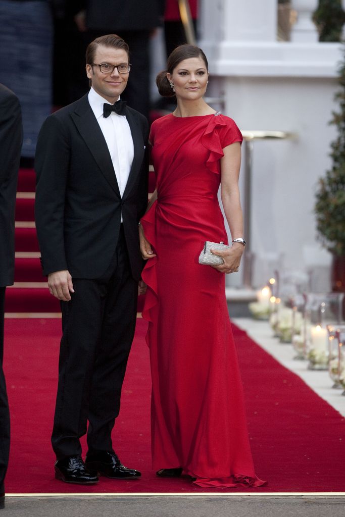 Crown Princess Victoria in red satin with husband