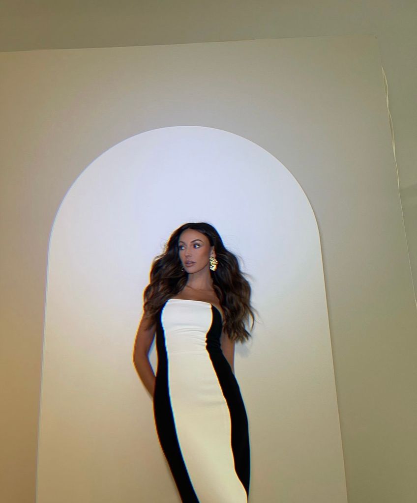 Michelle looked gorgeous in the black and white bodycon midi dress