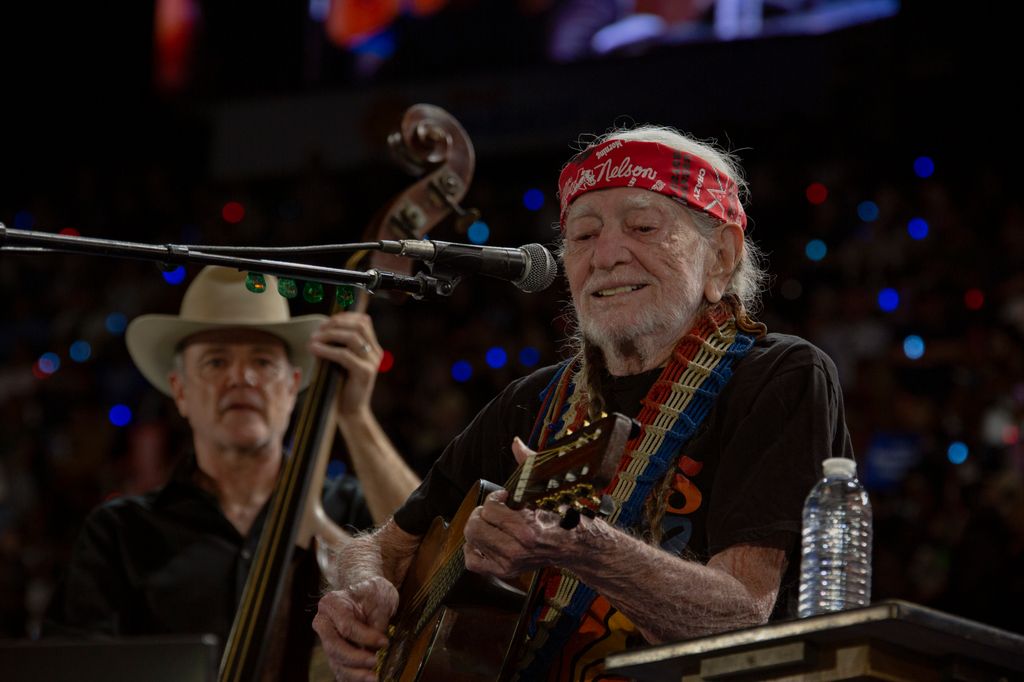 Willie Nelson plays at a rally for Vice President and Democratic presidential nominee Kamala Harris