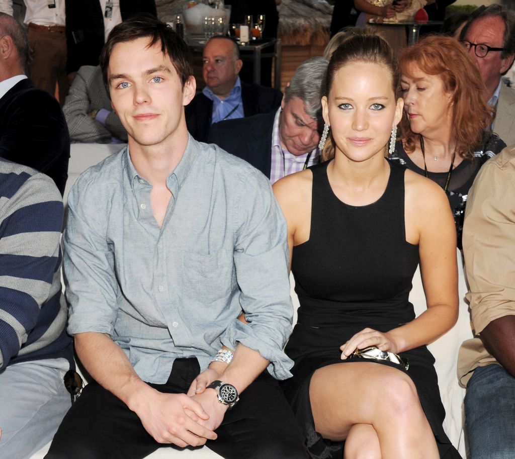 Nicholas Hoult (L) and Jennifer Lawrence attend a cocktail reception during Amber Lounge Fashion Monaco 2012 at Le Meridien Beach Plaza Hotel on May 25, 2012 in Monaco, Monaco