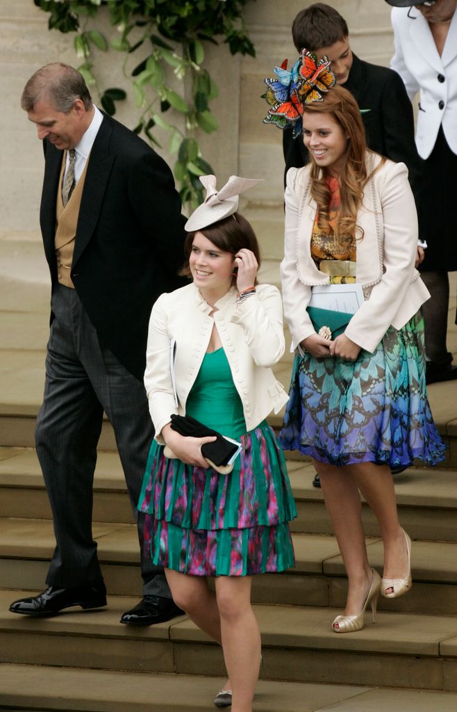 Princess Eugenie and Beatrice walk down steps in bright dresses