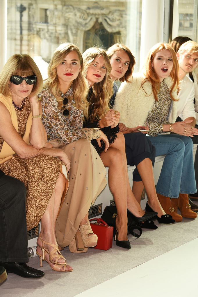 Anna Wintour, Suki Waterhouse and Alexa Chung sit on the front row of the the Topshop Unique show during London Fashion Week SS16, all wearing neutral shades of beige, Anna in her signature sunglasses