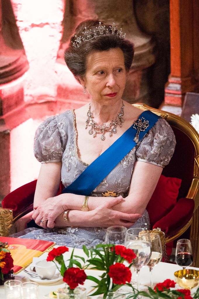 Princess Anne sitting in dress and tiara