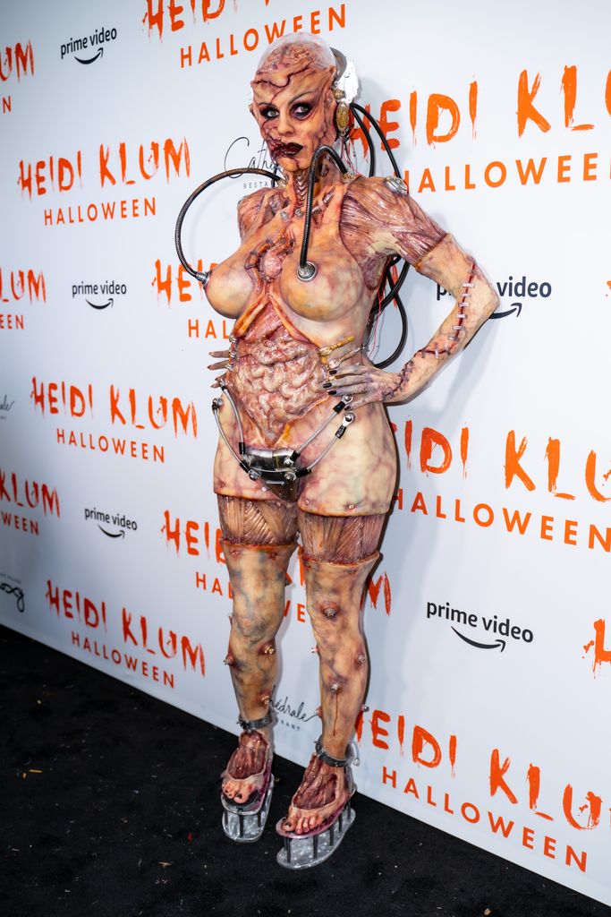 Heidi Klum attends Heidi Klum's 20th Annual Halloween Party dressed as an alien experiment gone wrong 