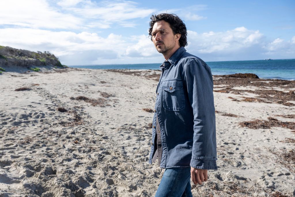 man walking on beach
