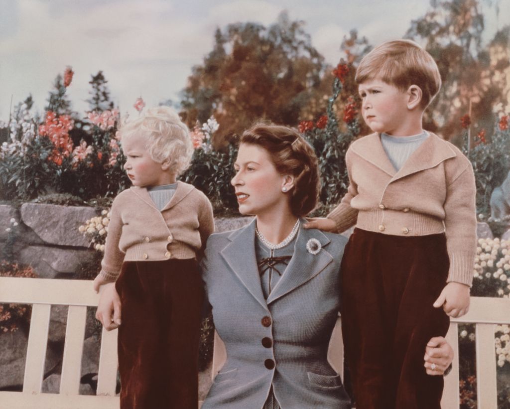 Queen Elizabeth II with Prince Charles and Princess Anne in the grounds of Balmoral Castle