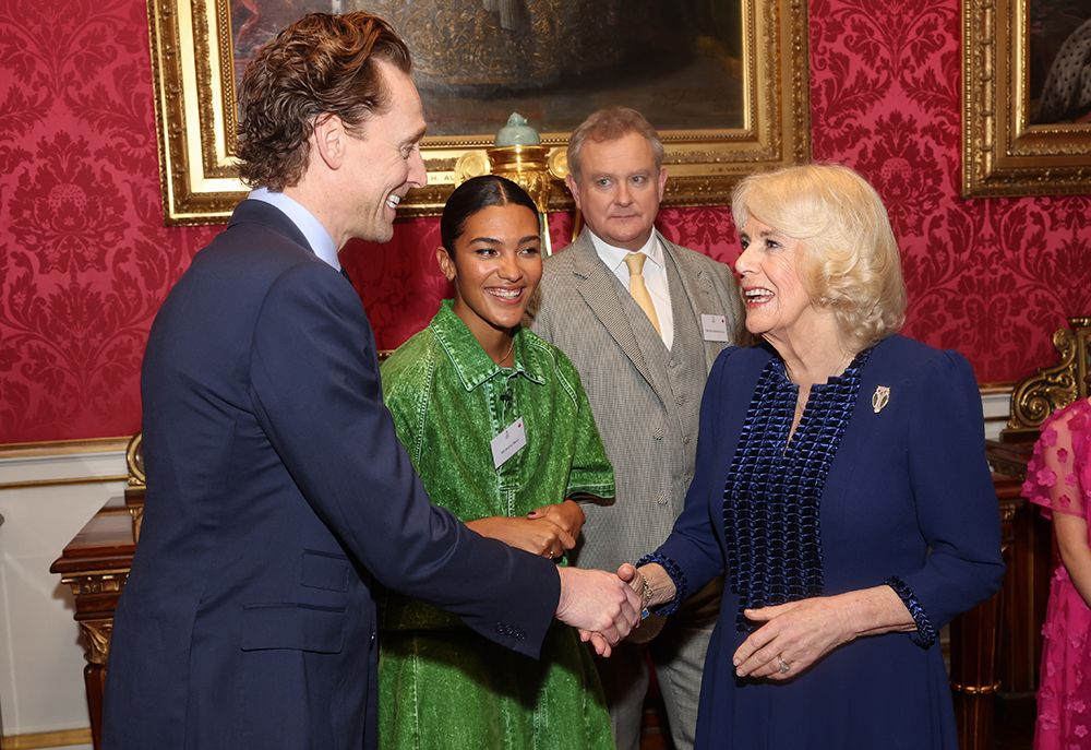 Tom Hiddleston with Queen Camilla at Buckingham Palace 