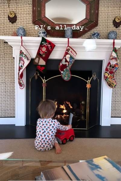 Jenna Bush Hagers son Hal sitting by the fireplace
