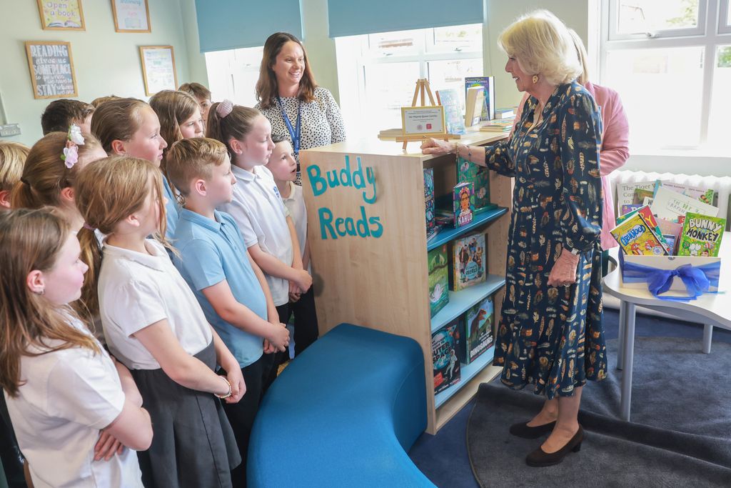 Queen Camilla talking to children