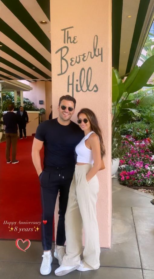 Michelle Keegan in a white crop top with her husband Mark Wright in black at the Beverly Hills Hotel