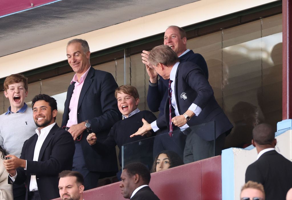 Prince George and Prince William celebrating