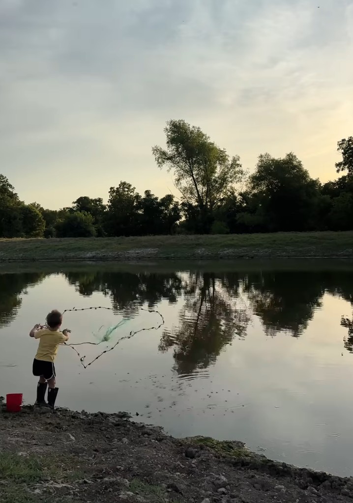 Still from a video shared by Joanna Gaines on Instagram of her son Crew net fishing