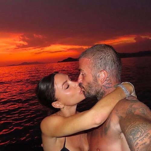 David and Victoria Beckham kissing 