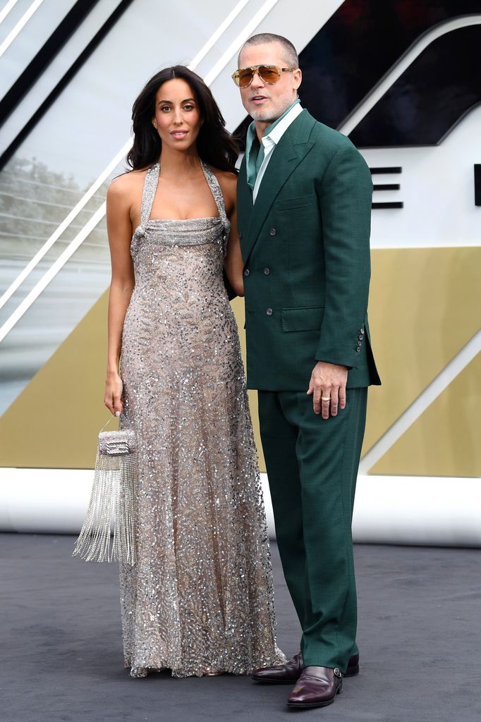Brad Pitt looks loved-up with girlfriend Ines de Ramon as they join Tom