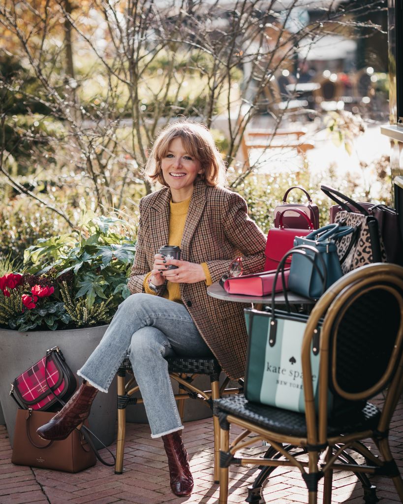 Alexandra sat next to some shopping bags