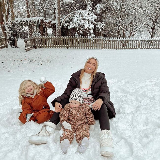 Stacey Solomon sitting in the snow with her son Rex and daughter Rose