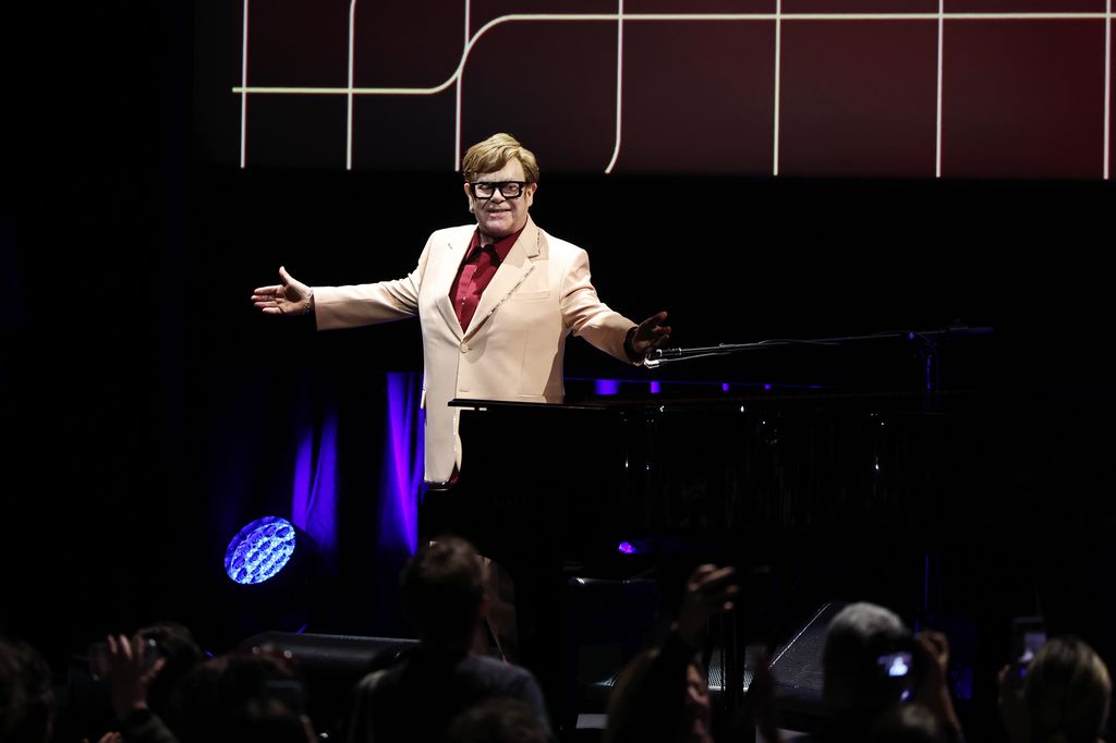 Elton John speaking to a crowd