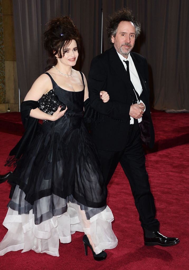 Helena Bonham Carter in a black and white dress and her husband Tim Burton on the red carpet