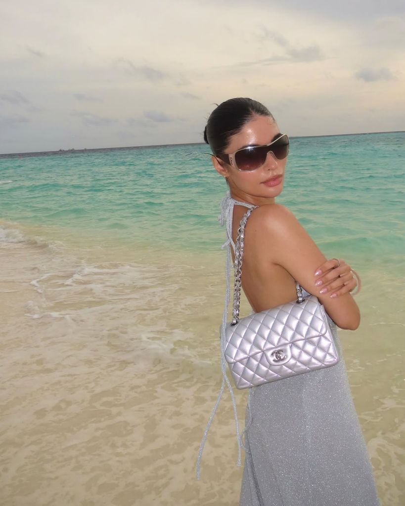 Aisha Potter in grey dress