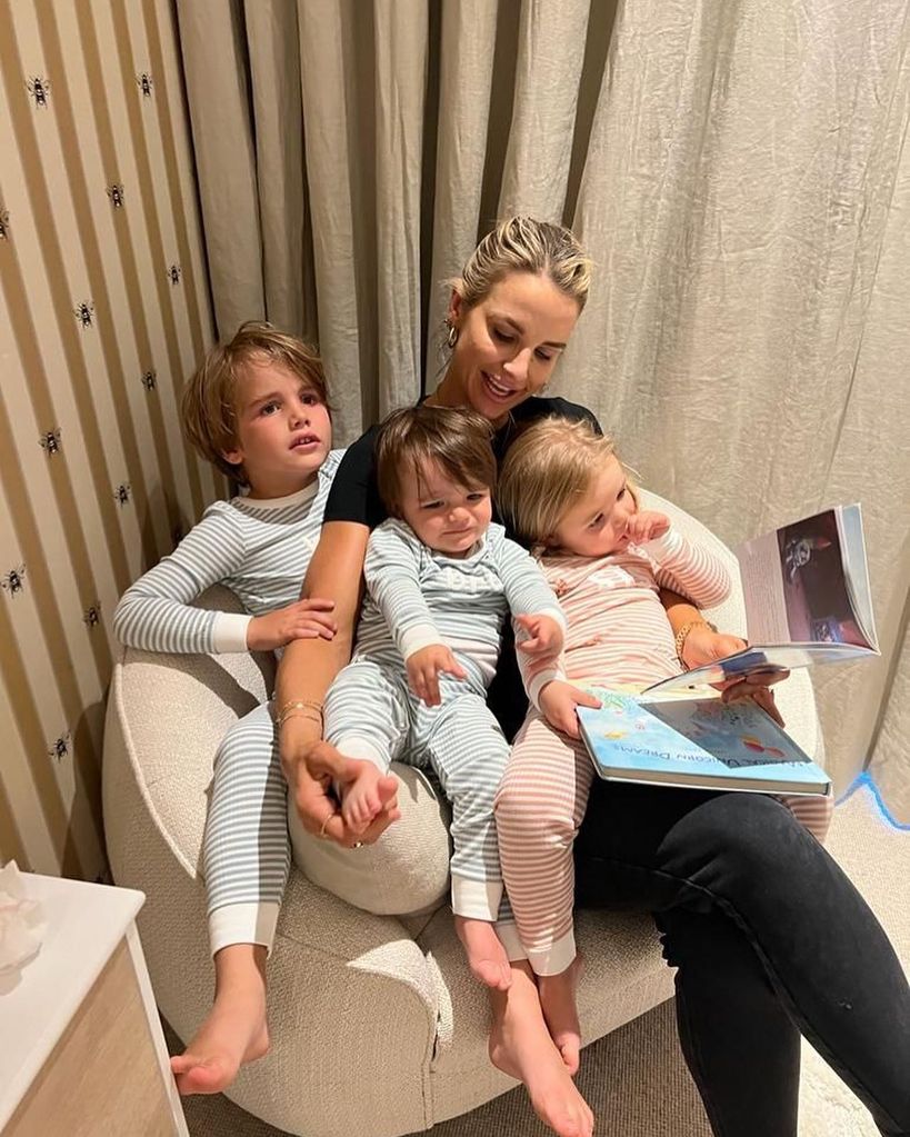 Vogue reading a book with the kids