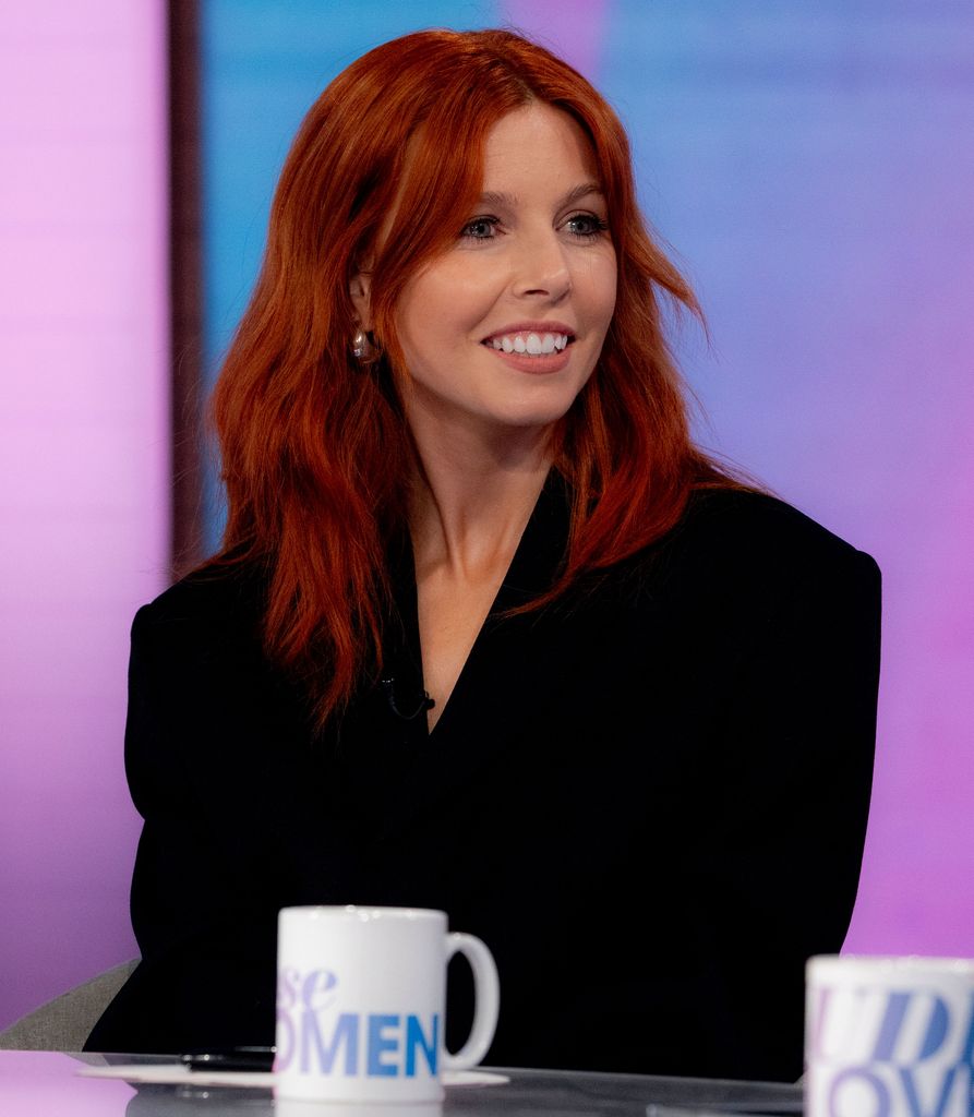 Stacey Dooley in a black suit