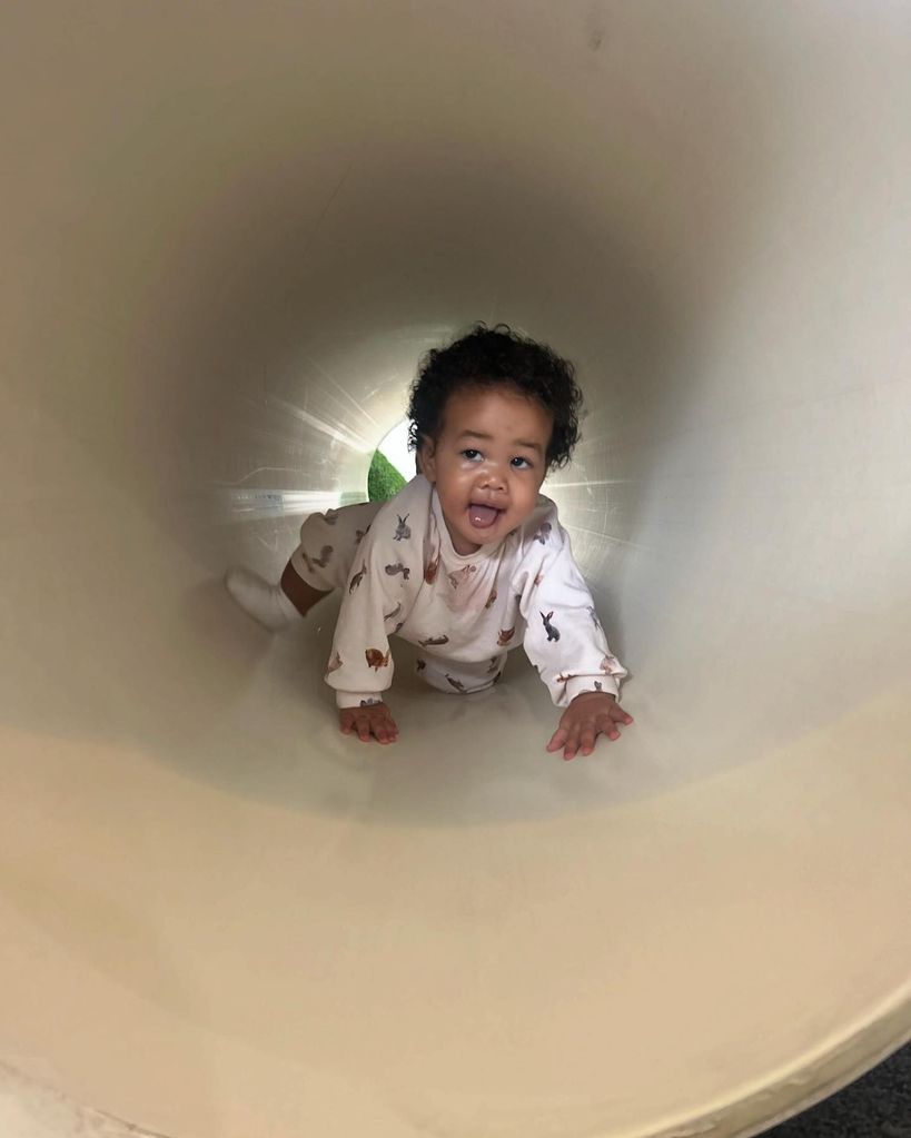 Chrissy Teigen and John Legend's baby son Wren crawling through tunnel