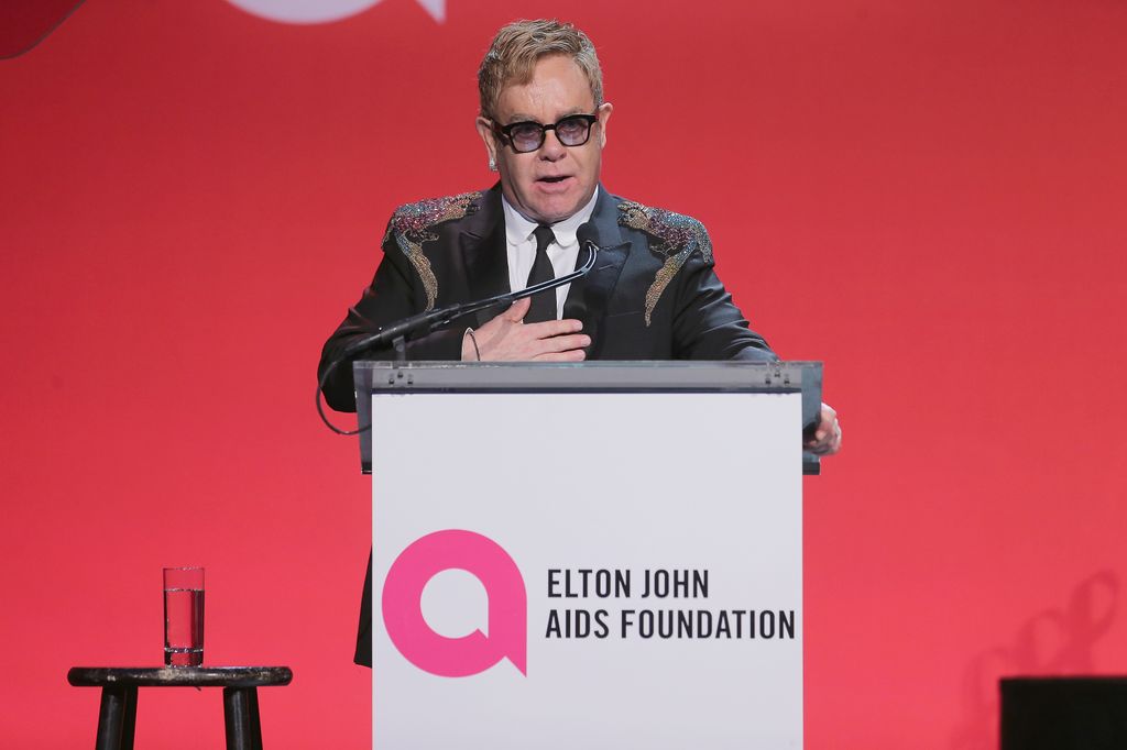 Sir Elton giving a speech on stage 