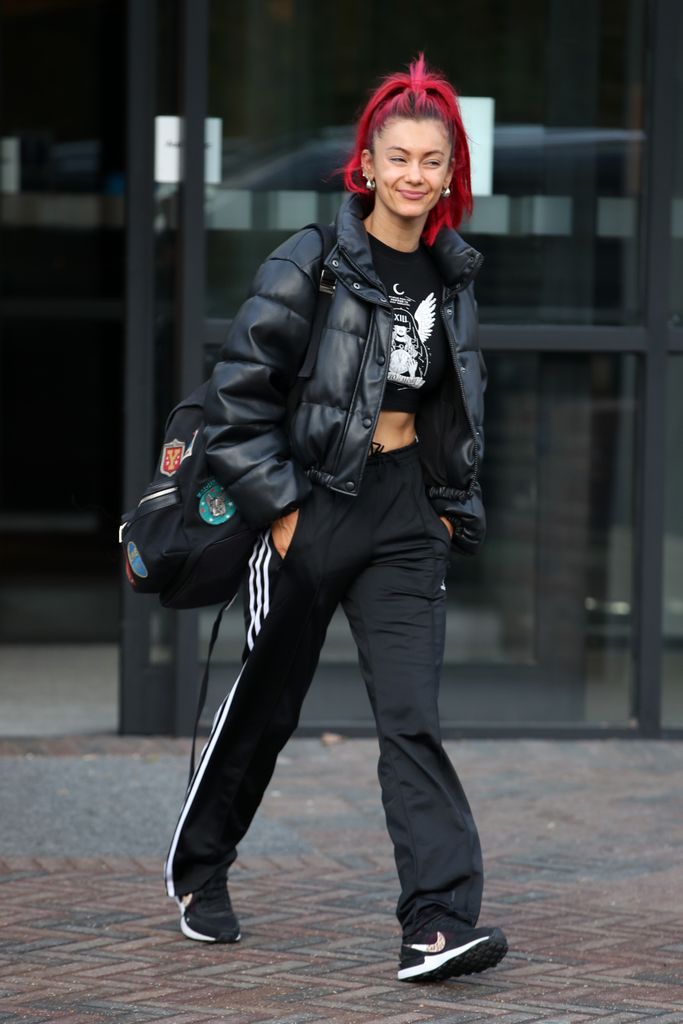 Dianne walking in cargos and cropped tee
