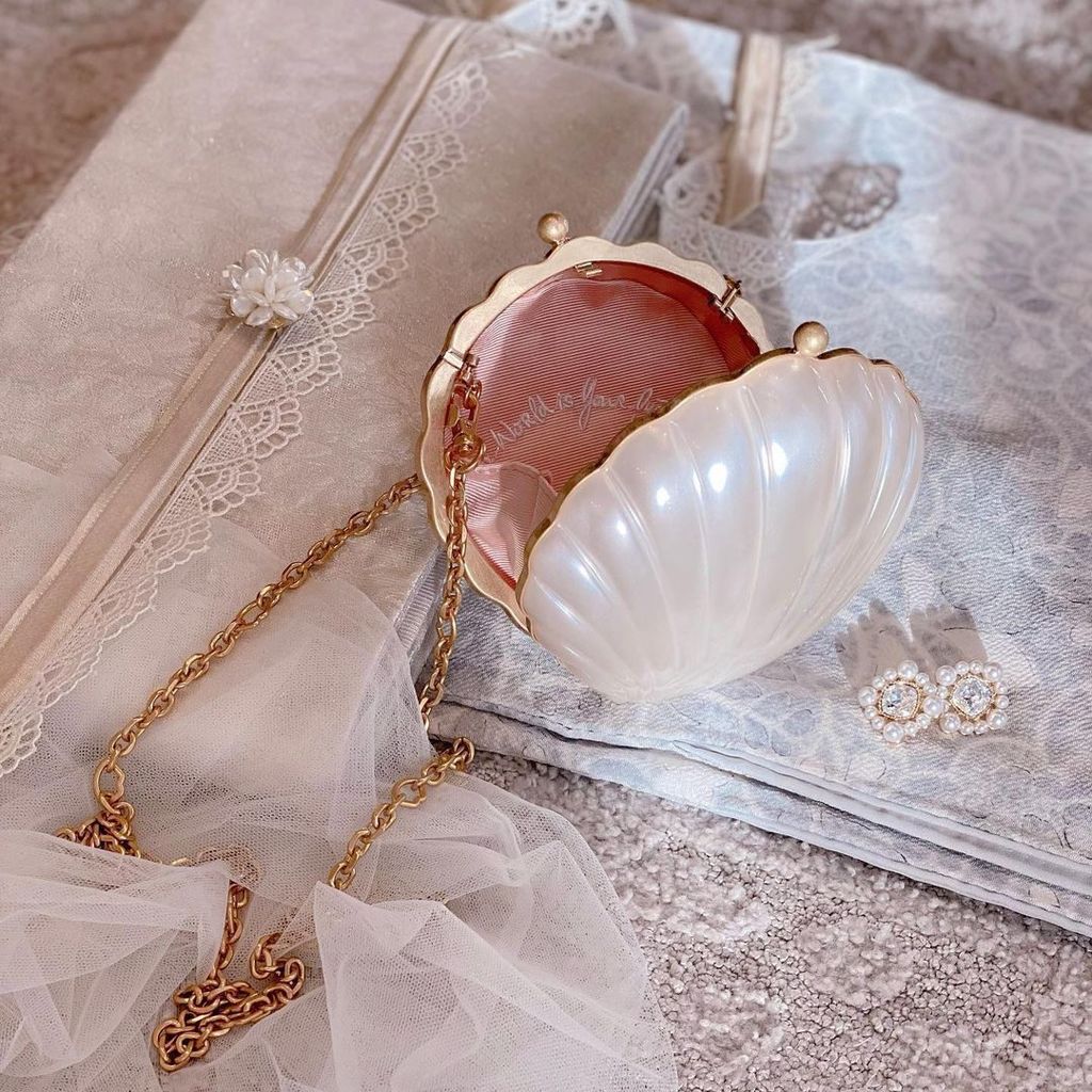 Vogue carried a Lulu Guinness bag - the beautiful pearl shell clutch