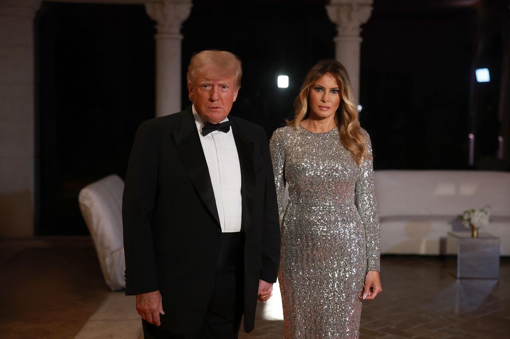 Trump and former first lady Melania Trump arrive for a New Years event at his Mar-a-Lago home on December 31, 2022 
