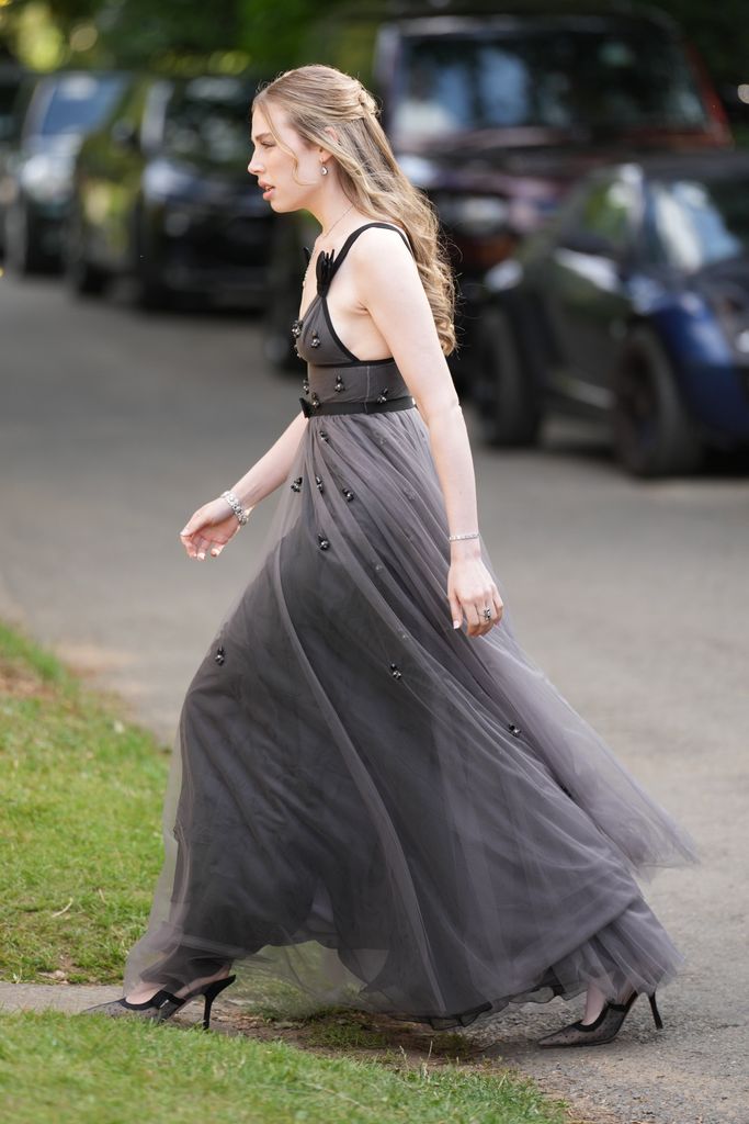 Guests arrive at the wedding of Eve Jobs to Harry Charles at St Michael's and All Angels Church, Great Tew, Oxfordshire, UK, on the 26th July 2025.